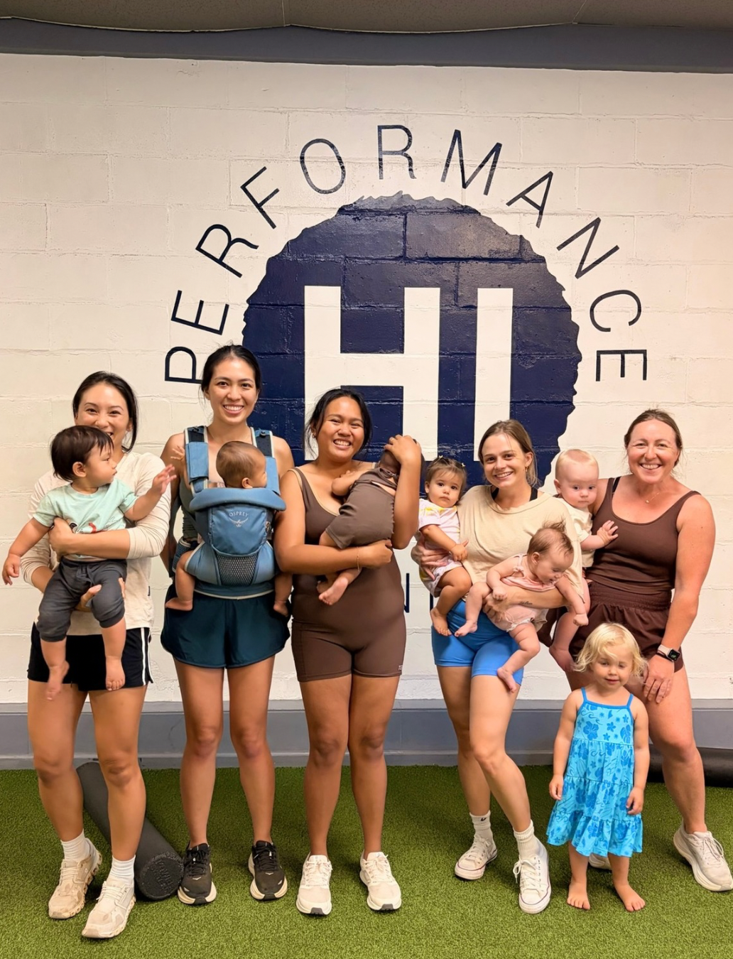 A group of moms and kids at the gym in Honolulu 