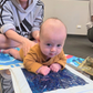 mom and baby doing tummy time on a sensory mat