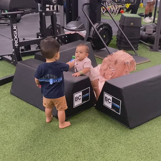 two toddlers at the gym