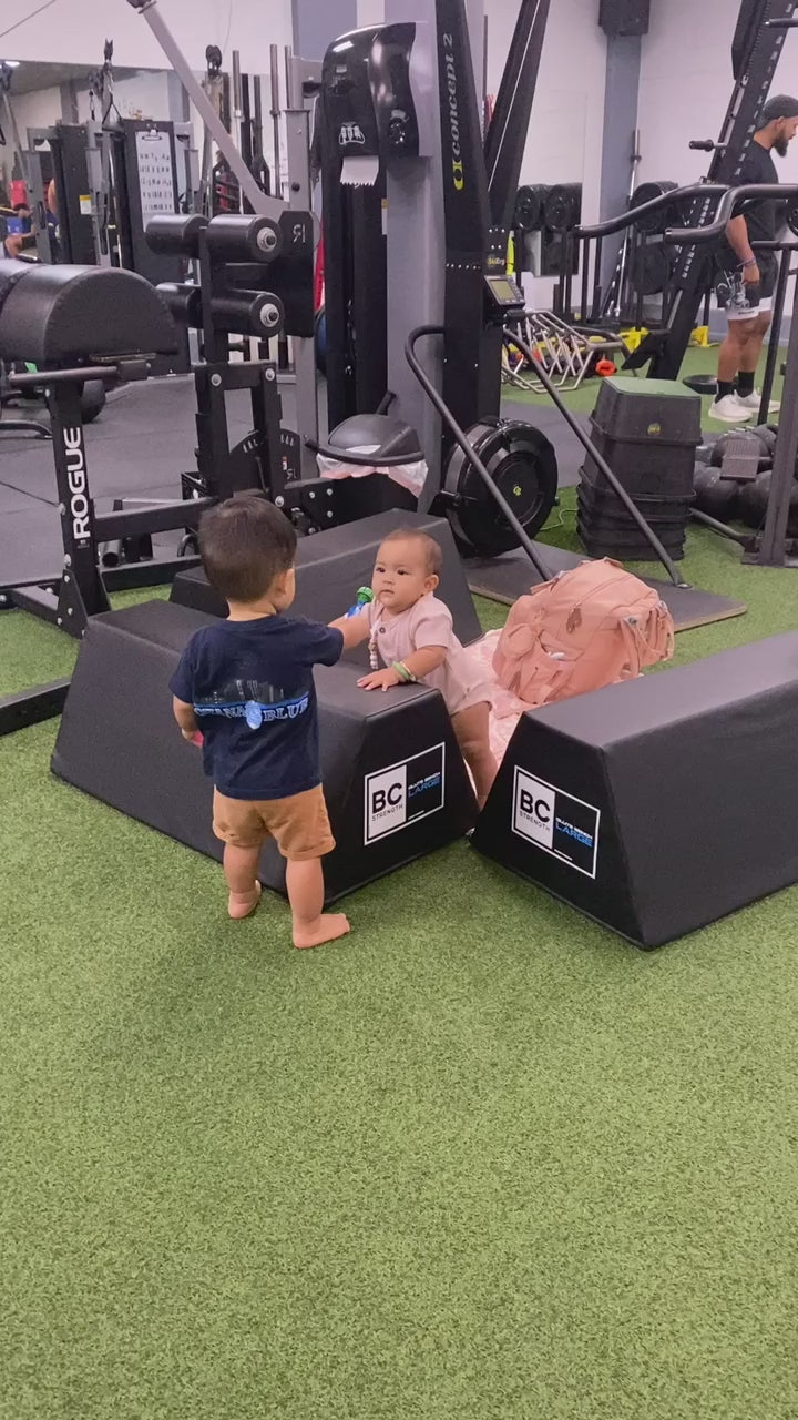 two toddlers at the gym